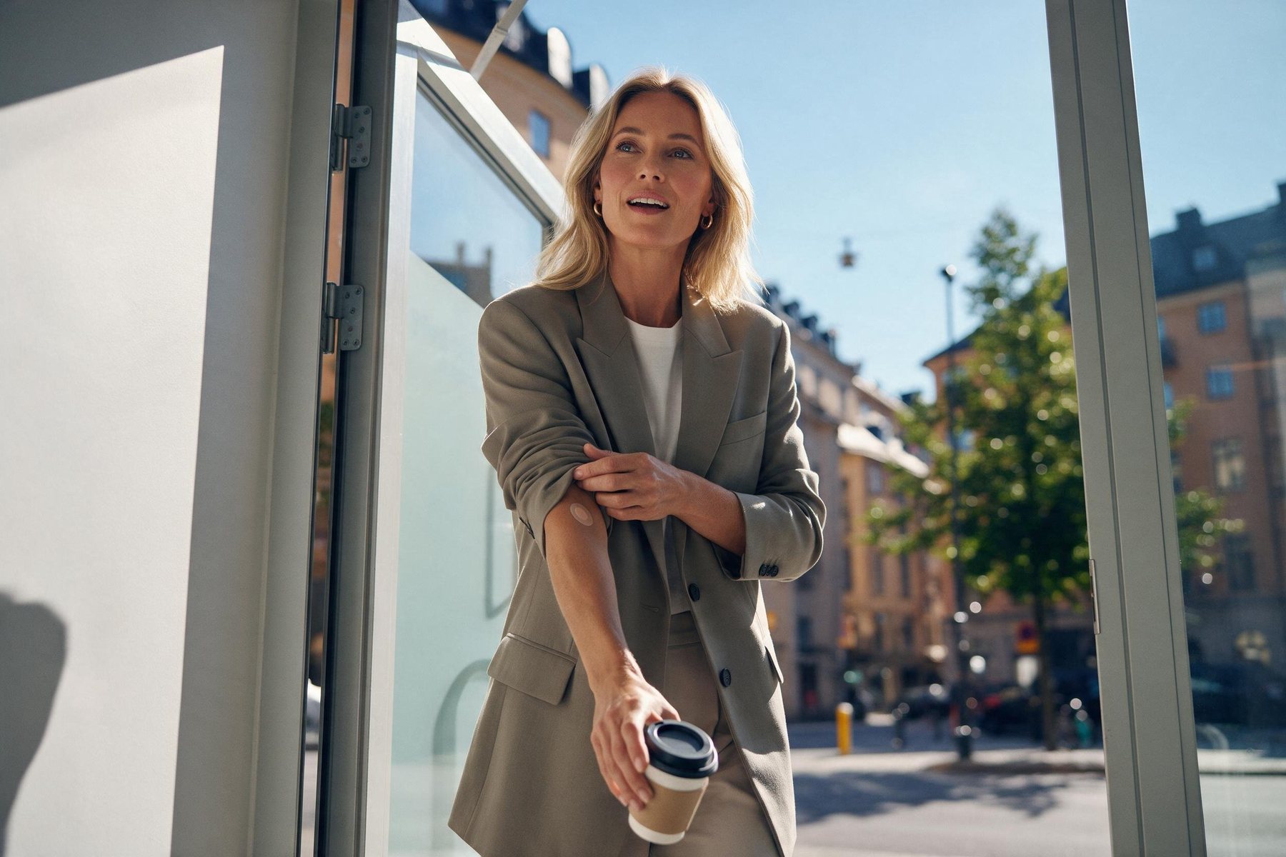 A woman leaving the lab on a bright morning
